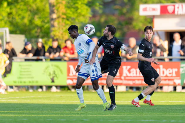 Soccer Mens Regionalliga Bayern Season 2025 2026 33 Matchday 08 05 2026 TSV Buchbach Viktoria Aschaffenburg SMR Arena Hady Kallo of SV Viktoria Aschaffenburg in a duel with Philipp Walter of TSV Buchbach Buchbach SMR Arena Bavaria Germany