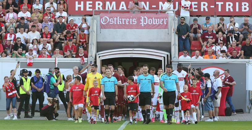 July 29, 2026 xmgoodx Offenbach am Main, Pluto Stadium at Bieberer Berg Anniversary Match: Kickers Offenbach OFC vs. VfB Stuttgart Teams take the field with the officiating crew: Jannis Jäschke, Olaf Kehne, Terlan Tervasolli