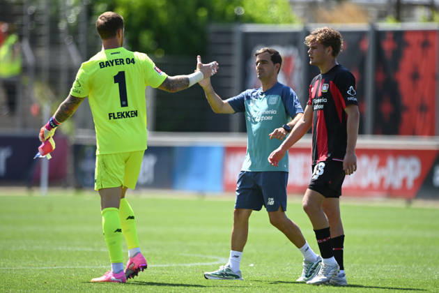 Final celebration, cheers, celebrating, joy, goalkeeper Mark FLEKKEN (LEV), coach Carles MARTINEZ (LEV), Ben HAWIGHORST (LEV), from left: Soccer 1. Bundesliga, friendly match, Bayer Leverkusen LEV vs. Rot-Weiss Essen 3–0, on August 1, 2026, in Leverkusen, Germany. DFL regulations prohibit any use of photographs as image sequences and or quasi-video.