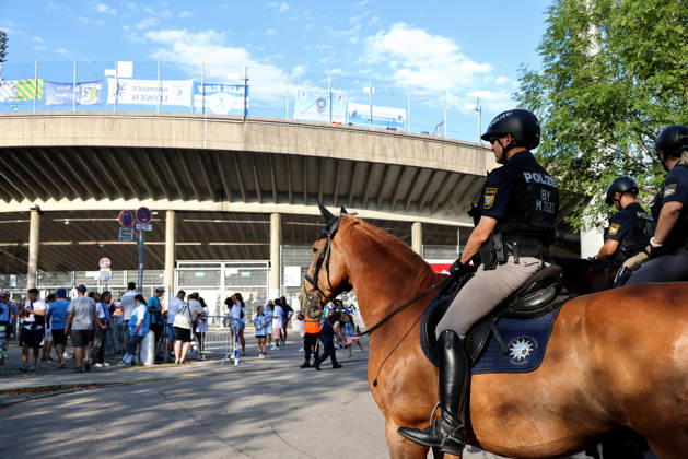 Soccer, Men s, Bavarian Regional League, 2026–2027 Season, TSV 1860 Munich vs. FC Augsburg II, Grünwalder Stadium: Here, a mounted police unit, police horses, police, security match, high-security match, danger, fans, security—in the background, the Westkurve stand at the Grünwalder Stadium in Munich
