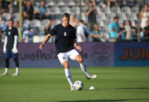 Soccer, Men s, Bavarian Regional League, 2026–2027 Season, TSV 1860 Munich vs. FC Augsburg II, Grünwalder Stadium. Dennis Dressel of TSV 1860 Munich kicks the ball during warm-ups.