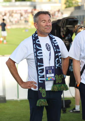 Soccer, Men s, Bavarian Regional League, 2026–2027 Season, TSV 1860 Munich vs. FC Augsburg II, Grünwalder Stadium; Gernot Mang, President of TSV 1860 Munich, savors the moment in front of the West Stand, surrounded by fans and ultras, standing with a fan scarf