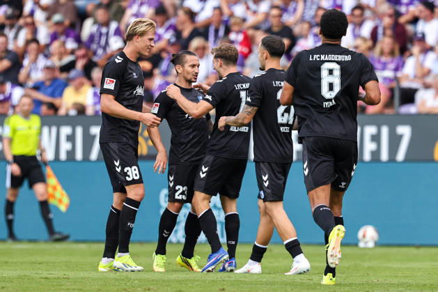 August 15, 2026, xkwix, soccer, 2. Bundesliga, VfL Osnabrück vs. 1. FC Magdeburg, Stadion an der Bremer Brücke, Matchday 2, 2026–2027 season. Goal celebration by Luka Hyrylaeinen (1. FC Magdeburg, No. 38), Baris Atik (1 FC Magdeburg, No. 23) and goal scorer Alexander Nollenberger (1 FC Magdeburg, No. 17) at 0–2. DFB regulations prohibit any use of photographs as image sequences and or quasi-video. Photo: xKamilxWilkowskixPressefotoKochx, Lower Saxony, Germany