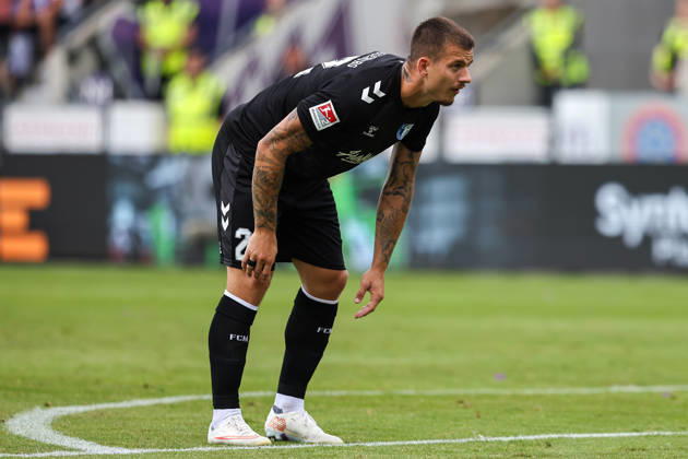 August 15, 2026, xkwix, Soccer, 2. Bundesliga, VfL Osnabrück vs. 1. FC Magdeburg, Stadion an der Bremer Brücke, Matchday 2, 2026–2027 Season: Mateusz Zukowski of FC Magdeburg, No. 22, looks determined as he bends over. DFB regulations prohibit any use of photographs as image sequences and or quasi-video. Photo: xKamilxWilkowskixPressefotoKochx, Lower Saxony, Germany