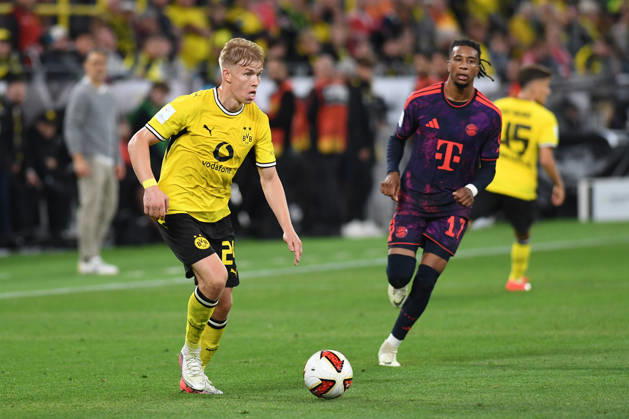 Daniel Svensson of Borussia Dortmund and Michael Olise of FC Bayern Munich battle for the ball during the 2026 Franz Beckenbauer Super Cup final between Borussia Dortmund and FC Bayern Munich at Signal Iduna Park on August 22, 2026, in Dortmund, Germany. Photo by Ralf Treese, DeFodi Images. Daniel Svensson of Borussia Dortmund and Michael Olise of FC Bayern Munich battle for the ball during the Franz Beckenbauer Supercup match between Borussia Dortmund and FC Bayern Munich at Signal Iduna Park on August 22, 2026 in Dortmund, Germany Photo by Ralf Treese DeFodi Images