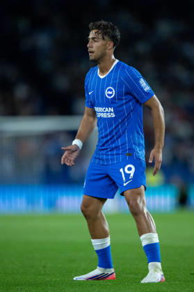Charalampos Kostoulas of Brighton & Hove Albion wearing the club s blue Nike home shirt with thin white vertical pinstripes, blue shorts with the white number 19, blue socks. Photo by Sebastian Frej UEFA Conference League Play-off Second Leg match: Brighton & Hove Albion and Tromso IL at BRIGHTON, ENGLAND - AUGUST 27, 2026 Copyright: xSebastianxFrejx