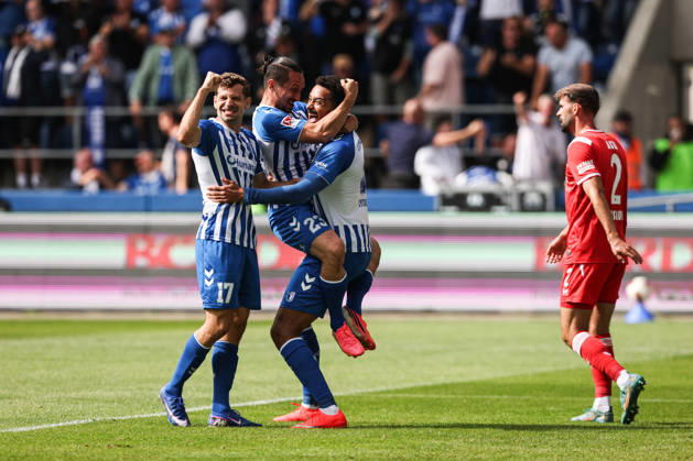 Goal celebration: Goal scorer Emmanuel Iyoha (1 FC Magdeburg, 8) scores the 1-0 goal with Baris Atik (1 FC Magdeburg, 23) and Alexander Nollenberger (1 FC Magdeburg,17, 2026–2027 Bundesliga season: 1 FC Magdeburg vs. 1 FC Kaiserslautern at the Avnet Arena in Magdeburg; action, soccer, man, men, Germany, September 12, 2026