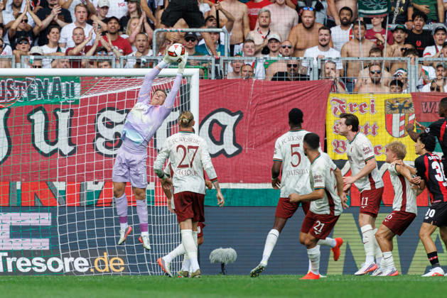 Finn Dahmen 1, FC Augsburg, holds the ball securely during the match between FC Augsburg and Bayer 04 Leverkusen, soccer, men s, Bundesliga, 2026–2027, Matchday 3 on September 12, 2026, in Augsburg, WWK ARENA. DFL and DFB regulations prohibit any use of photographs as image sequences and or quasi-video. Bavaria, Germany