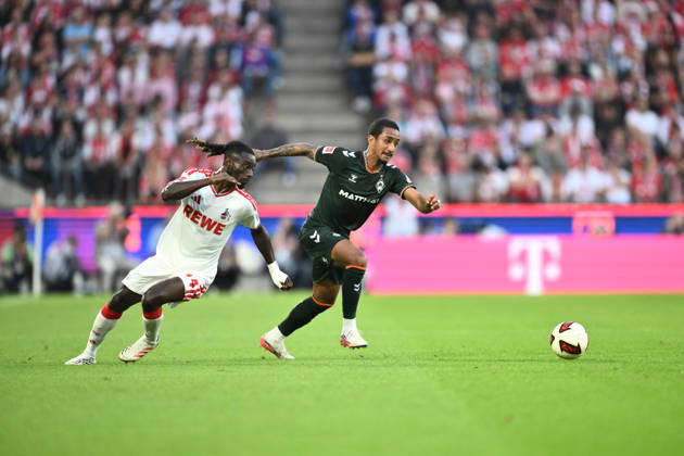 September 12, 2026, GER, Soccer, Men s, 1. Bundesliga, 2026–2027 Season, Matchday 3, 1. FC Köln vs. SV Werder Bremen Arthur Werder Bremen, 13 in a tackle with Gideon Mensah of 1. FC Köln, 14 DFB and DFL regulations prohibit any use of photographs as image sequences and or quasi-video. Köln Rhein Energie Stadium, NRW, Germany Copyright: xNordphoto Wiegandx