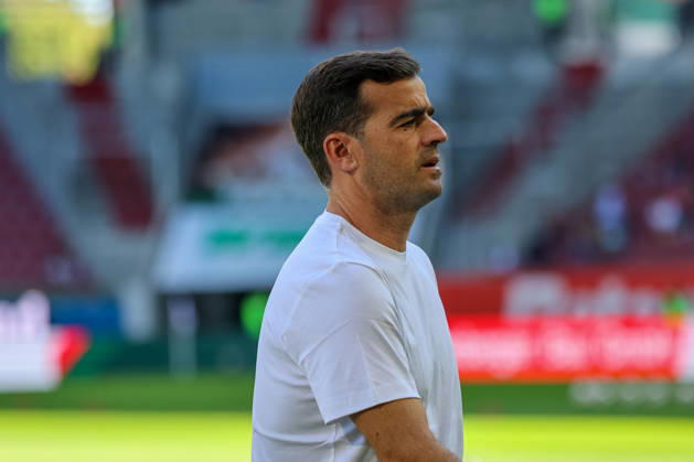 Carles Martinez, Bayer 04 Leverkusen, Head Coach before the game, cutout, portrait, side view, GER, FC Augsburg vs. Bayer 04 Leverkusen, soccer, Bundesliga, Matchday 3, 2026–2027 season, September 12, 2026, DFL and DFB regulations prohibit any use of photographs as image sequences and or quasi-video, GER, FC Augsburg vs. Bayer 04 Leverkusen, soccer, Bundesliga, Matchday 3, 2026–2027 season, September 12, 2026, Augsburg Copyright: xEibner-Pressefoto JennixMaulx EP_JML