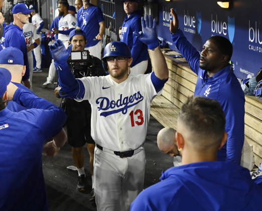 Los Angeles Dodgers Max Muncie celebrates with teammates in the dugout after hitting a solo home run against the San Francisco Giants in a five-run eighth inning at Dodger Stadium in Los Angeles on Friday, September 18, 2026. The Dodgers defeated the Giants 8-2.  LAP2026091804 JIMxRUYMEN