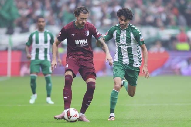 Calvin Brackelmann of FC Augsburg and Eren Dinkci of Werder Bremen battle for the ball during the Bundesliga match between SV Werder Bremen and FC Augsburg at Weserstadion on September 19, 2026, in Bremen, Germany Photo by Marco Steinbrenner, DeFodi Images Calvin Brackelmann of FC Augsburg and Eren Dinkci of Werder Bremen battle for the ball during the Bundesliga match between SV Werder Bremen and FC Augsburg at Weserstadion on September 19, 2026 in Bremen, Germany. Photo by Marco Steinbrenner, DeFodi Images. DFB and DFL regulations prohibit any use of photographs as image sequences and or quasi-video. Photo by Marco Steinbrenner, DeFodi Images.