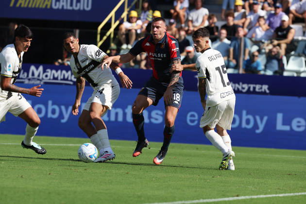 Genoa™s Milutin Osmajic fights for the ball with Parma™s Enrico Delprato and Emanuele Valeri during the Serie A soccer match between Parma and Genoa at the Ennio Tardini Stadium in Parma, north west Italy - September 20, 2026. - Soccer  Copyright: xGiannixSantandrea LaPressex
