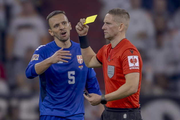 Munich, Germany October 1, 2026 UEFA Nations League 2026–2027 League Phase Group A2 Match 3 Germany vs. Serbia Pictured from left: Nemanja Maksimovic (SRB) receives a yellow card from referee Espen Eskas (NOR). DFB and DFL regulations prohibit any use of photographs as image sequences and or quasi-video. Allianz Arena, Bayern Copyright: xFotostandx xSchäferx