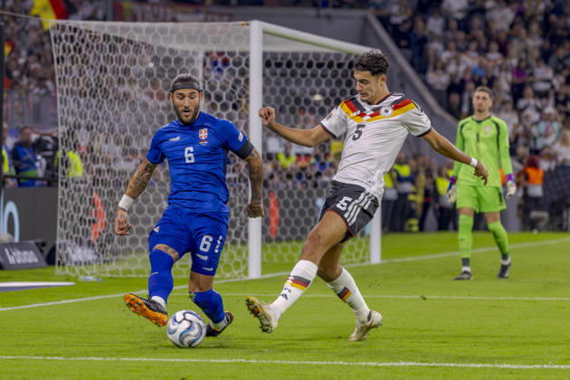 Munich, Germany October 1, 2026 UEFA Nations League 2026–2027 League Phase Group A2 Match 3 Germany vs. Serbia Pictured from left in a tackle: Nemanja Gudelj (SRB) and Aleksandar Pavlovic (GER). DFB and DFL regulations prohibit any use of photographs as image sequences and or quasi-video. Allianz Arena, Bayern Copyright: xFotostandx xSchäferx