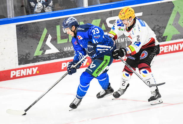 Straubing Tigers vs. Pinguins Bremerhaven, Ice Hockey, German Ice Hockey League, Penny DEL, Matchday 5, 2026–2027 Season, October 2, 2026: J. C. Beaudin of the Straubing Tigers on the boards with Akito Hirose of the Pinguins Bremerhaven, Men’s Ice Hockey, German Ice Hockey League, Penny DEL, Matchday 5, 2026–2027 season on October 2, 2026, at the Eisstadion am Pulverturm; Straubing Tigers (blue) vs. Pinguins Bremerhaven (white)