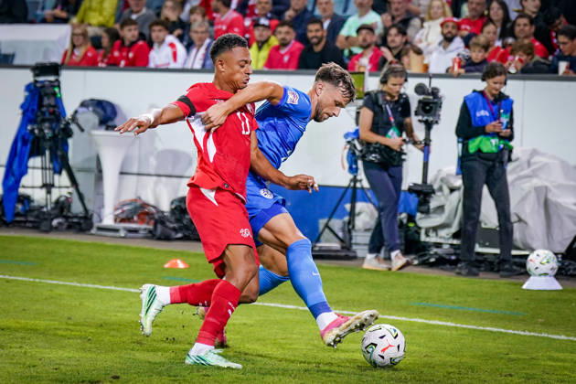Soccer: UEFA Nations League 2026–2027, Matchday 3: Switzerland vs. Slovenia at Thermoplan Arena Lucerne—Dan Ndoye (Switzerland, No. 11) and David Brekalo (Slovenia, No. 23) in a tackle Copyright: xJOERANxSTEINSIEKx