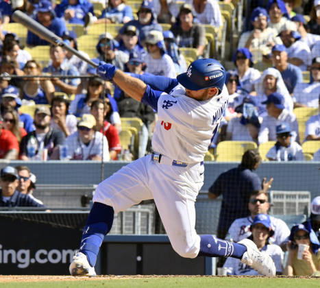 Los Angeles Dodgers Max Muncy hits a solo home run in the sixth inning against the Atlanta Braves in game one of the National League Division Series at Dodger Stadium on Saturday, October 3, 2026 in Los Angeles, California. The Dodgers defeated the Braves 5-3. LAP20261003806 JIMxRUYMEN