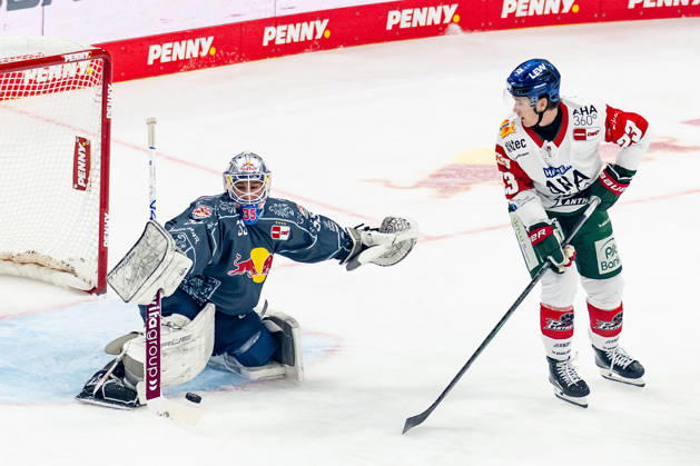 Mathias Niederberger, goaltender, EHC Red Bull Munich, 35, makes a save against Jimmy Lambert of the Augsburger Panther, 23, GER; EHC Red Bull Munich vs. Augsburger Panther, DEL, 2026–2027 season, Matchday 6, October 4, 2026 Photo: HMB Media, Franz Feiner Copyright: HMBxMedia FranzxFeiner