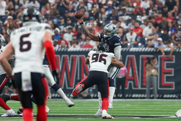 HOUSTON, TX - OCTOBER 04: Quarterback Dak Prescott 4 of the Dallas Cowboys is forced to throw early as defensive end Logan Hall 96 of the Houston Texans gets pressure up the middle during the NFL, American Football Herren, USA football game between the Houston Texans and Dallas Cowboys on October 4, 2026, at Reliant Stadium in Houston, TX. (Photo by David Buono Icon Sportswire) NFL: OCT 04 Cowboys at Texans EDITORIAL USE ONLY Icon241004021