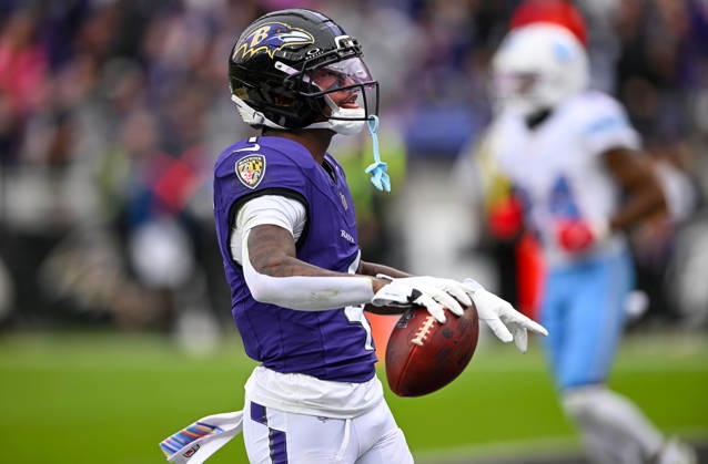 Baltimore Ravens wide receiver Zay Flowers (4) scores a touchdown after a 19 yard pass reception against the Tennessee Titans during the second quarter at M&T Bank Stadium in Baltimore, Maryland, on Sunday, October 4, 2026.  BAL20261004102 DAVIDxTULIS