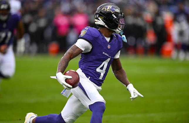 Baltimore Ravens wide receiver Zay Flowers (4) scores a touchdown after a 19 yard pass reception against the Tennessee Titans during the second quarter at M&T Bank Stadium in Baltimore, Maryland, on Sunday, October 4, 2026.  BAL20261004111 DAVIDxTULIS