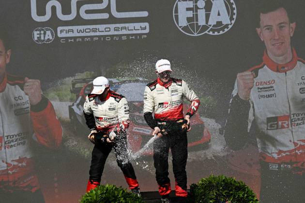 IPA89309436 - ,Driver Elfyn Evans and Co-Driver Scott Martin of the Toyota Gazoo Racing WRT team, driving the Toyota GR Yaris Rally1, celebrate their victory as champions during the FIA World Rally Championship WRC, Motorsport Rallye, WM Rally Italia Sardegna 2026 on October 4 in Alghero, Sardinia, Italy Copyright: xLucaxBarsali IPAxSportx xx IPA89309436