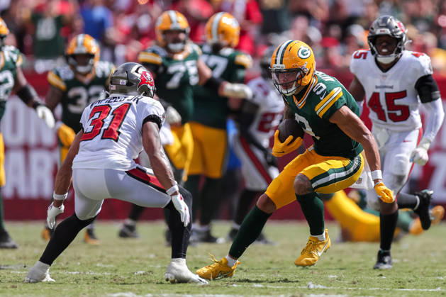 Oct 4, 2026; Tampa, FL, USA; Green Bay Packers wide receiver Christian Watson (9) attempts to avoid a tackle by Tampa Bay Buccaneers safety Antoine Winfield Jr. (31) after catching a pass during the NFL, American Football Herren, USA game between the Green Bay Packers and Tampa Bay Buccaneers at Raymond James Stadium. Mandatory Credit: Taylor McFee-Cal Media NFL 2026: Packers Vs Buccaneers OCT 04  - ZUMAc04_ 20261004_zma_c04_088 Copyright: xTaylorxMcfeex