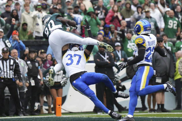 PHILADELPHIA, PA - OCTOBER 04: Philadelphia Eagles wide receiver Darius Cooper 80 leaps over Los Angeles Rams safety Quentin Lake 37 for a touchdown during the game between the Los Angeles Rams and the Philadelphia Eagles on October 4, 2026 at Lincoln Financial Field in Philadelphia, PA.(Photo by Andy Lewis Icon Sportswire) NFL, American Football Herren, USA OCT 04 Rams at Eagles EDITORIAL USE ONLY Icon261004004