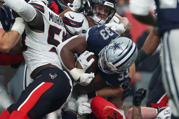 HOUSTON, TX - OCTOBER 04: Running back Javonte Williams 33 of the Dallas Cowboys is crushed between a number of players during the NFL, American Football Herren, USA football game between the Houston Texans and Dallas Cowboys on October 4, 2026, at Reliant Stadium in Houston, TX. (Photo by David Buono Icon Sportswire) NFL: OCT 04 Cowboys at Texans EDITORIAL USE ONLY Icon241004165