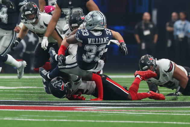 HOUSTON, TX - OCTOBER 04: Running back Javonte Williams 33 of the Dallas Cowboys is hit high and low by safety Reed Blankenship 6 of the Houston Texans and safety Calen Bullock 2 of the Houston Texans during the NFL, American Football Herren, USA football game between the Houston Texans and Dallas Cowboys on October 4, 2026, at Reliant Stadium in Houston, TX. (Photo by David Buono Icon Sportswire) NFL: OCT 04 Cowboys at Texans EDITORIAL USE ONLY Icon241004182