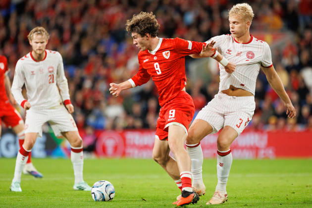 RECORD DATE NOT STATED 4th October 2026; Cardiff City Stadium, Cardiff, Wales; UEFA Nations League Football, Wales versus Denmark; Lewis Koumas of Wales shields ball from Oliver Provstgaard of Denmark AmandaxMcMaster