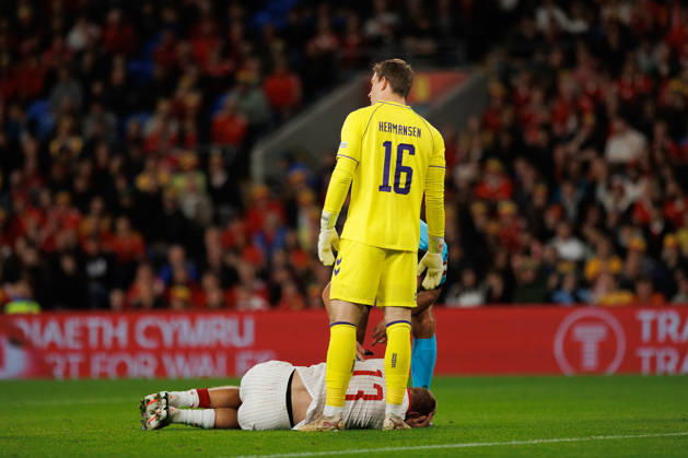 RECORD DATE NOT STATED 4th October 2026; Cardiff City Stadium, Cardiff, Wales; UEFA Nations League Football, Wales versus Denmark; Mads Hermansen of Denmark stands over Rasmus Kristensen of Denmark after collision with Wales player AmandaxMcMaster
