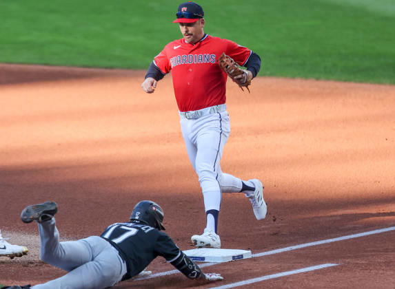 Cleveland Guardians first baseman Nathaniel Lowe (46) steps on first to put out a diving Chicago White Sox Sam Antonacci (17) in the first inning of an MLB, Baseball Herren, USA American League Division Series playoff game at Progressive Field in Cleveland, Ohio, on Monday, October 5, 2026.  CLE20261005702 AARONxJOSEFCZYK