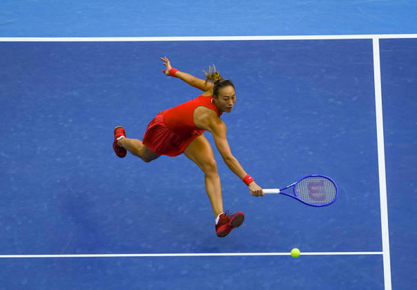 (261006) -- BEIJING, Oct. 6, 2026 -- Zheng Qinwen of China hits a return during the women s singles round of 32 match against Marie Bouzkova of the Czech Republic at 2026 China Open tennis tournament in Beijing, China, Oct. 5, 2026. ) XINHUA PHOTOS OF THE DAY SunxFei