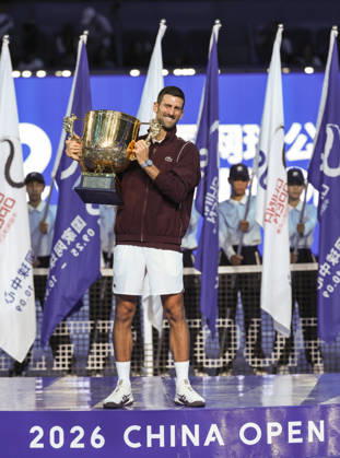 (261006) -- BEIJING, Oct. 6, 2026 -- Novak Djokovic of Serbia poses with the champion trophy during the awarding ceremony for the men s singles final at 2026 China Open tennis tournament in Beijing, China, Oct. 6, 2026. ) (SP)CHINA-BEIJING-TENNIS-CHINA OPEN-MEN S SINGLES-AWARDING CEREMONY(CN) BaixXuefei