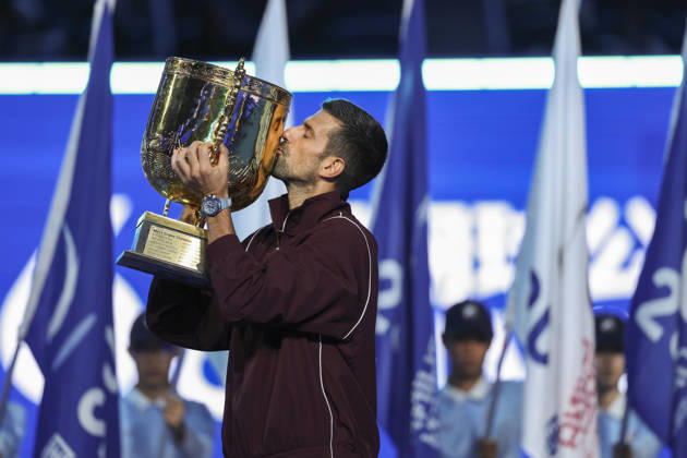 (261006) -- BEIJING, Oct. 6, 2026 -- Novak Djokovic of Serbia kisses the champion trophy during the awarding ceremony for the men s singles final at 2026 China Open tennis tournament in Beijing, China, Oct. 6, 2026. ) (SP)CHINA-BEIJING-TENNIS-CHINA OPEN-MEN S SINGLES-AWARDING CEREMONY(CN) BaixXuefei