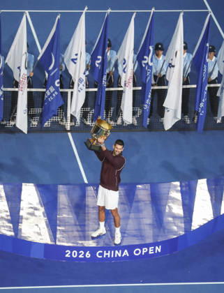 (261006) -- BEIJING, Oct. 6, 2026 -- Novak Djokovic of Serbia holds up the champion trophy during the awarding ceremony for the men s singles final at 2026 China Open tennis tournament in Beijing, China, Oct. 6, 2026. (Photo by Xinhua) (SP)CHINA-BEIJING-TENNIS-CHINA OPEN-MEN S SINGLES-AWARDING CEREMONY(CN) MaxZihan