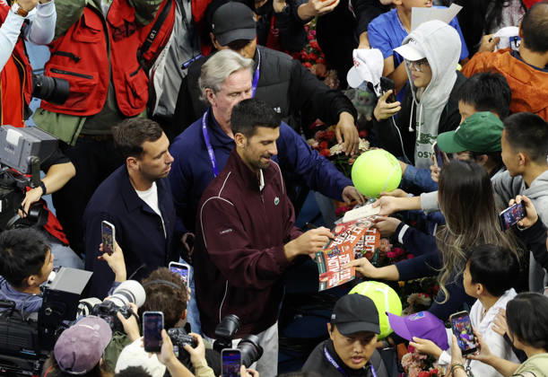 (261006) -- BEIJING, Oct. 6, 2026 -- Novak Djokovic of Serbia signs autographs for supporters after the awarding ceremony for the men s singles final at 2026 China Open tennis tournament in Beijing, China, Oct. 6, 2026. ) (SP)CHINA-BEIJING-TENNIS-CHINA OPEN-MEN S SINGLES-AWARDING CEREMONY(CN) ZhangxChenlin