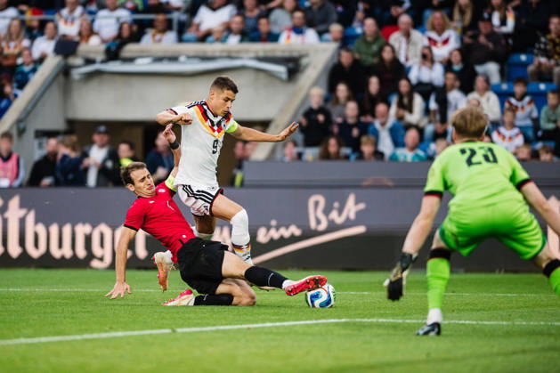 U-21 European Championship Qualifier: Germany vs. Georgia, October 6, 2026: Nicolò Tresoldi (Germany, No. 9) is tackled by Aleksandre Narimanidze (Georgia, No. 4). Soccer, U-21 European Championship Qualifiers, Matchday 10: Germany vs. Georgia on October 6, 2026, Bielefeld DFB REGULATIONS PROHIBIT ANY USE OF PHOTOGRAPHS AS IMAGE SEQUENCES AND OR QUASI-VIDEO Copyright: xBEAUTIFULxSPORTS Tonhäuserx