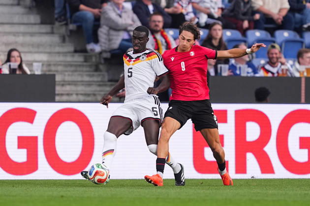 October 6, 2026, xydrx, Men s, Soccer, International Match, U21, European Championship Qualifiers, Germany vs. Georgia, 2026–2027 Season, Schüco Arena: Joshua Quarshie (GER), No. 5, in a tackle against Diego Deisadze (GEO), No. 9. DFB regulations prohibit any use of photographs as image sequences and or quasi-video Copyright: HMBxMedia YannisxDreimann