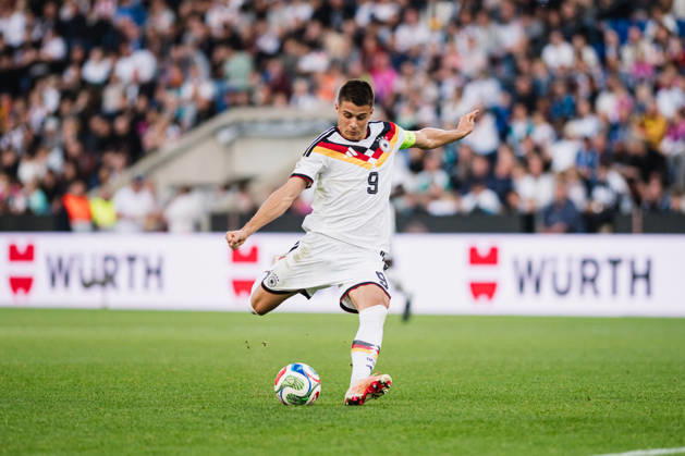 U-21 European Championship Qualifier: Germany vs. Georgia, October 6, 2026; Nicolò Tresoldi, Germany, 9, taking a soccer shot; U-21 European Championship Qualifier, Matchday 10: Germany vs. Georgia on October 6, 2026; Bielefeld DFB REGULATIONS PROHIBIT ANY USE OF PHOTOGRAPHS AS IMAGE SEQUENCES AND OR QUASI-VIDEO Copyright: xBEAUTIFULxSPORTS Tonhäuserx