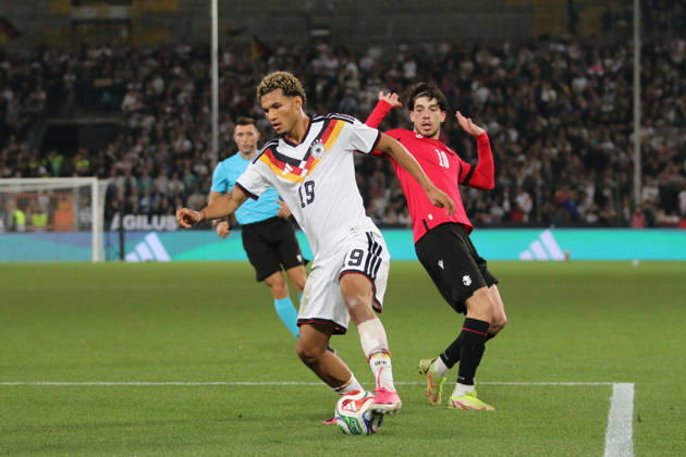 October 6, 2026 Men s Soccer 2026–2027 UEFA U-21 European Championship Qualifiers Matchday 12 Germany vs. Georgia SchücoArena, Bielefeld Paris Brunner, Germany, 19, in white, passes Nikoloz Dadiani of Georgia, 10, in red, in Bielefeld, North Rhine-Westphalia, Germany