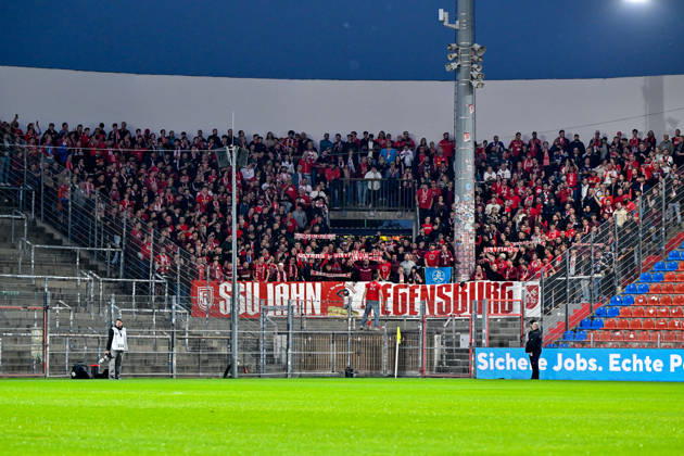 Regensburg fans, packed visiting fan section, fans, crowd, spectators, atmosphere, stadium, October 6, 2026, Unterhaching, Germany, soccer, BFV Association Cup, quarterfinals, SpVgg Unterhaching vs. SSV Jahn Regensburg xslx