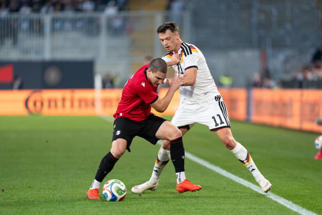 October 6, 2026, GER, Germany U21 vs. Georgia U21: A duel between Dzenan Pejcinovic (Germany U21, No. 11) and Aleksandre Amisulashvili (Georgia U21, No. 5) at the SchücoArena in Bielefeld, Germany Copyright: xnordphotoxGmbHx xChristianxSchulzex