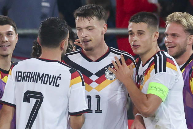 Dzenan Pejcinovic (Germany) celebrates after scoring his team s second goal alongside Arijon Ibrahimovic (Germany) and Nicolo Tresoldi (Germany) during the UEFA Under-21 EURO qualifier between Germany U21 and Georgia U21 at Almstadion on October 6, 2026 in Bielefeld, Germany. Photo by Marco Steinbrenner, DeFodi Images