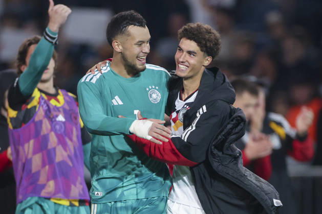 Goalkeepers Mio Backhaus (Germany) and Noah Darvich (Germany) cheer during the UEFA Under-21 EURO qualifier between Germany U21 and Georgia U21 at Almstadion on October 6, 2026, in Bielefeld, Germany. Photo by Marco Steinbrenner, DeFodi Images