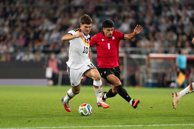 October 6, 2026, GER, Germany U21 vs. Georgia U21: A duel between Mert Kömür (Germany U21, No. 10) and Giorgi Robakidze (Georgia U21, No. 8) at the SchücoArena in Bielefeld, Germany Copyright: xnordphotoxGmbHx xChristianxSchulzex