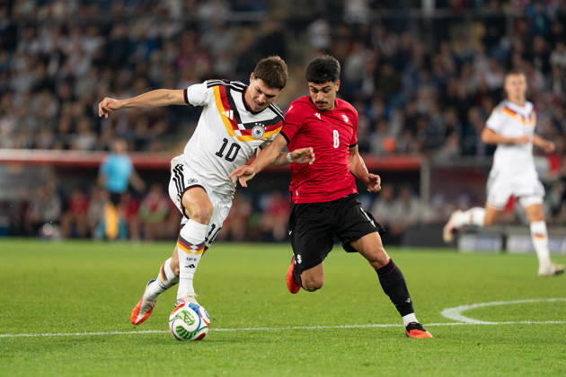 October 6, 2026, GER, Germany U21 vs. Georgia U21: A duel between Mert Kömür (Germany U21, No. 10) and Giorgi Robakidze (Georgia U21, No. 8) at the SchücoArena in Bielefeld, Germany Copyright: xnordphotoxGmbHx xChristianxSchulzex