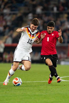 October 6, 2026, GER, Germany U21 vs. Georgia U21: A duel between Mert Kömür (Germany U21, No. 10) and Giorgi Robakidze (Georgia U21, No. 8) at the SchücoArena in Bielefeld, Germany Copyright: xnordphotoxGmbHx xChristianxSchulzex